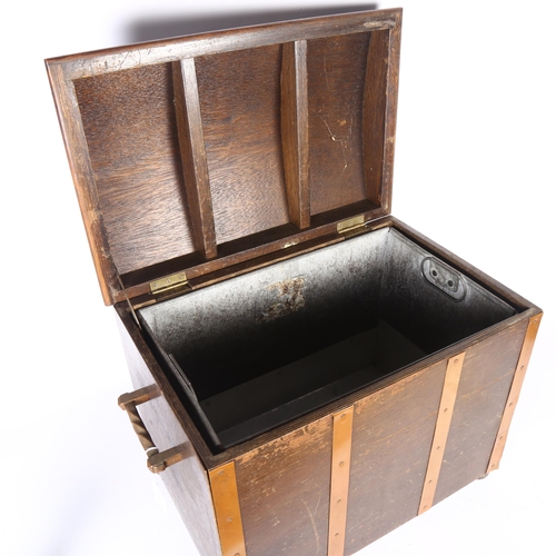 397 - A copper-bound oak coal box with 2 handles, H37cm