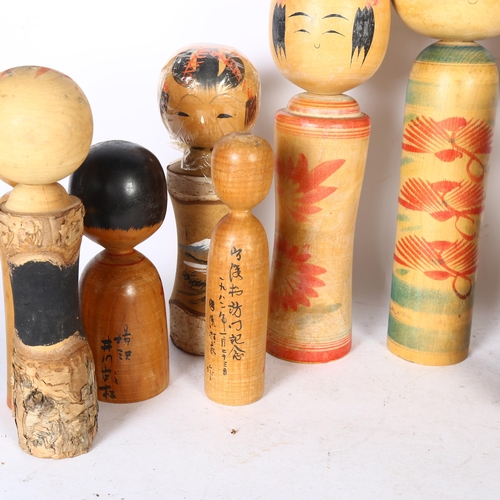 409 - A group of 10 Vintage Japanese Kokeshi wooden dolls, with painted decoration, tallest 37cm