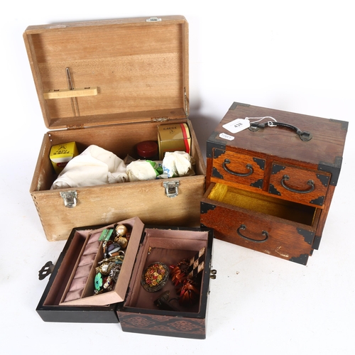 438 - An Oriental wooden First Aid box and contents, 31cm across, a table-top stained wood chest of 3 draw... 