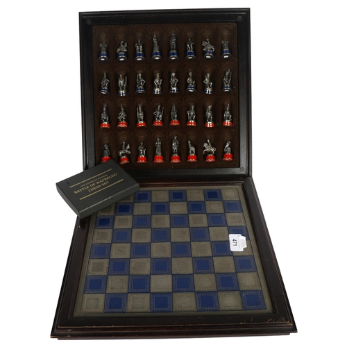 471 - A Battle of Waterloo chess set, produced by the Waterloo Museum, chess board 34cm across