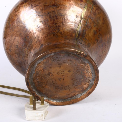 223 - A studded brass and copper table lamp, impressed to the base F D H