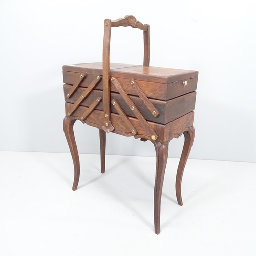 2196 - A French oak cantilever sewing box. 52x82x27cm.