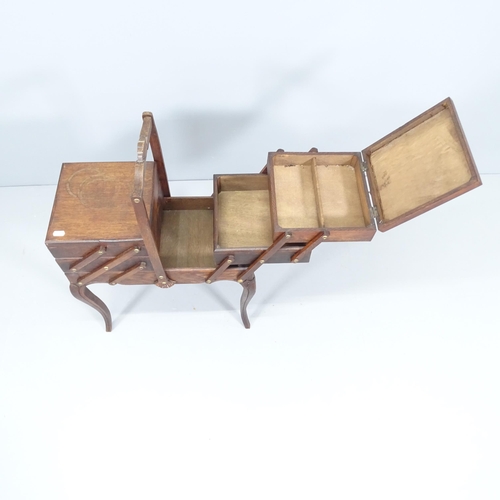 2196 - A French oak cantilever sewing box. 52x82x27cm.