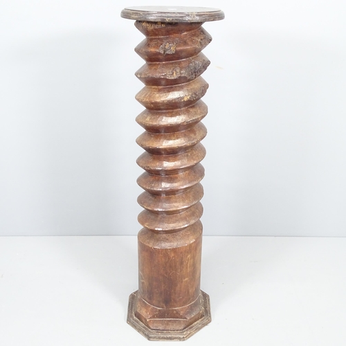 2199 - A French elm spiral turned column with circular top, on octagonal base. 30x110cm.