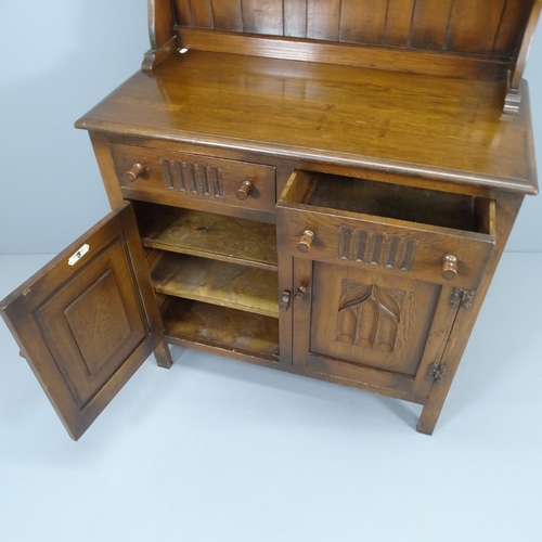 2200 - A reproduction oak two-section dresser, with carved decoration and label for Webber Furniture. 95x16... 