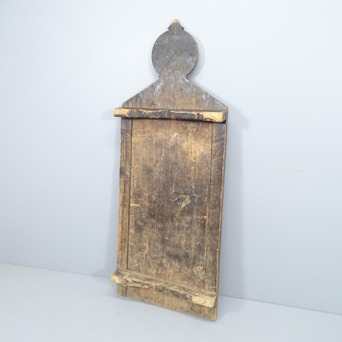 2204 - An antique oak Himalayan prayer board, with chip carved decoration. 62x158x14cm