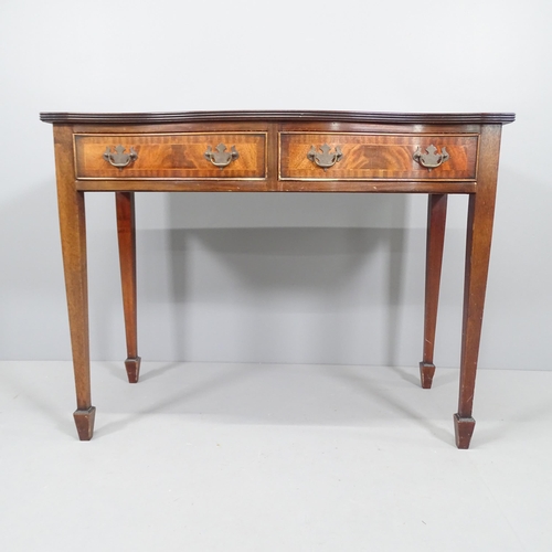 2205 - A reproduction crossbanded rosewood veneered writing desk of serpentine form, with 2 drawers on tape... 