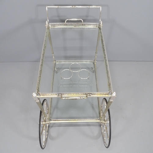 2209 - A mid-century French chrome and glass two-tier drinks trolley in the manner of Maison Bagues. 90x75x... 