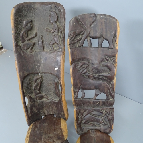 2226 - Two hand carved African two-piece chairs. Tallest 82cm.