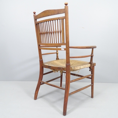 2231 - A 19th century rush-seated Sussex chair, with Arts and Crafts cushion, height 86cm