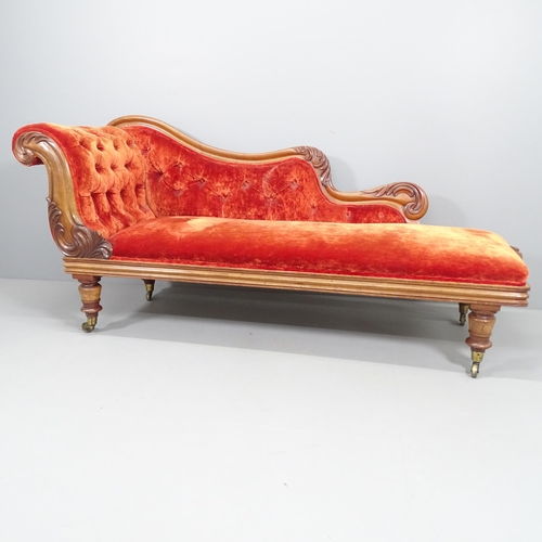 2240 - A Victorian mahogany and upholstered chaise longue, with carved acanthus leaf decoration and raised ... 