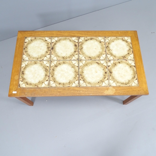 2247 - A mid-century teak tile-top coffee table. 93x42x52cm.