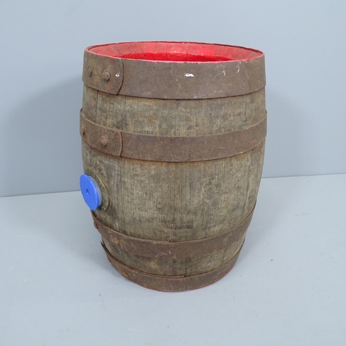 2251 - A vintage coopered oak barrel, with impressed marks for Young & Co. Brewery of London. Height 43cm.