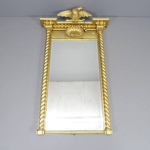 2255 - A modern gilt-painted over-mantle mirror, surmounted by an eagle with carved decoration and barley t... 