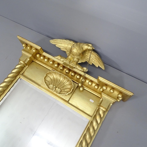 2255 - A modern gilt-painted over-mantle mirror, surmounted by an eagle with carved decoration and barley t... 