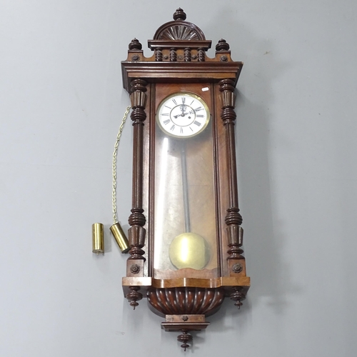 2259 - A carved walnut cased Vienna regulator wall clock.