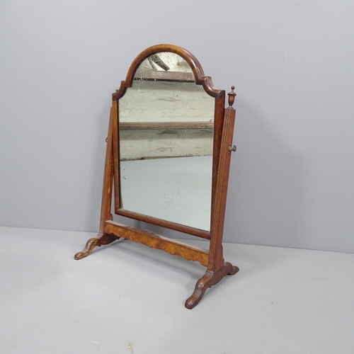 2262 - A Victorian walnut swing toilet mirror. 44x63cm