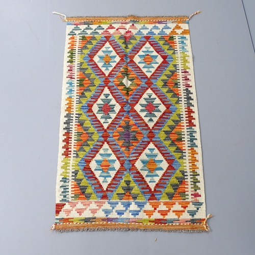 2270 - A Chobi Kilim rug. 130x77cm.