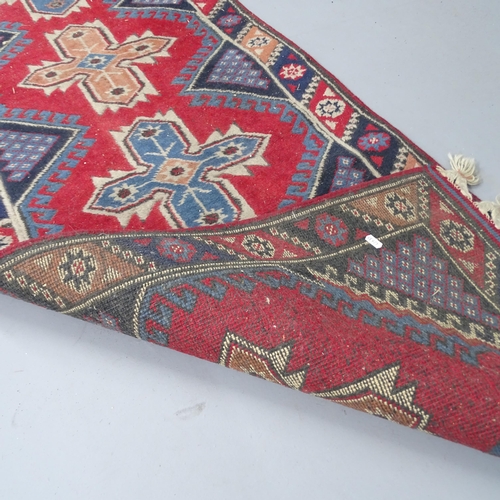 2285 - A red-ground Oushak runner. 280x73cm.