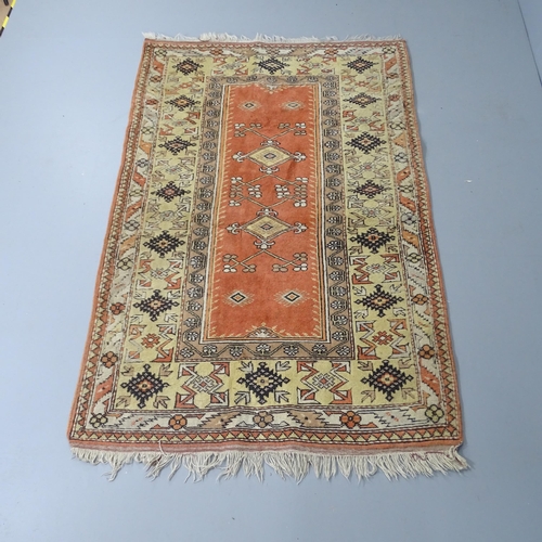 2287 - A cream-ground Caucasian rug. 190x120cm.