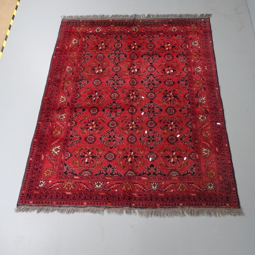 2303 - A red-ground Baluchi rug. 200x155cm