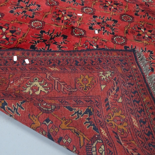 2303 - A red-ground Baluchi rug. 200x155cm