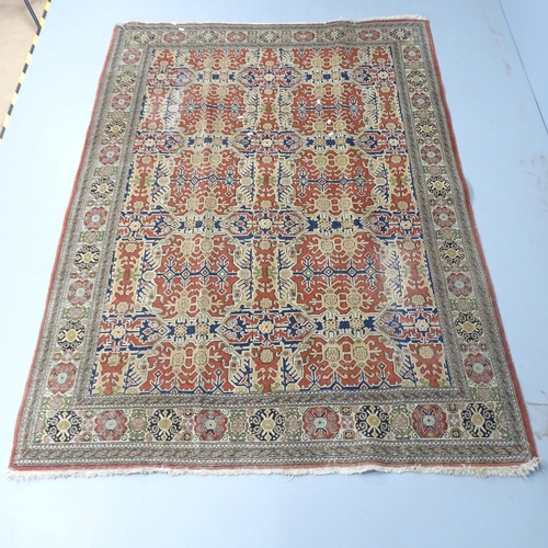 2305 - A cream-ground Kerman rug. 232x165cm