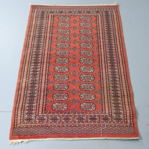 2308 - A red-ground Bokhara rug. 150x98cm