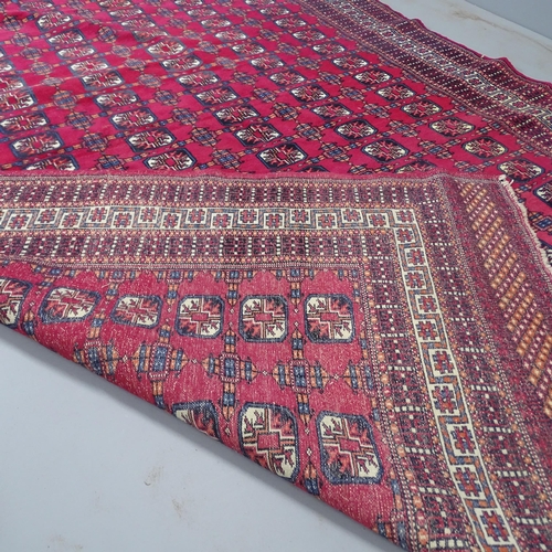 2309 - A red-ground Bokhara rug. 275x185cm.