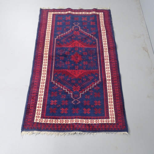 2315 - A red and blue-ground Turkish rug. 200x113