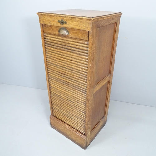 2323 - A tambour front music / filling cabinet. 46x110x39cm. With key.