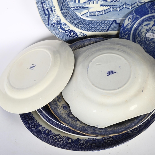 487 - Victorian Willow pattern meat plate, other blue and white plates, pair of vases, and a ginger jar