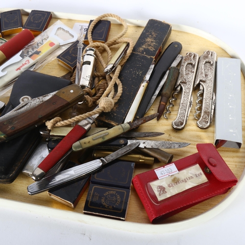 492 - A collection of penknives, pocket lighters, Vintage whistle, bottle openers etc