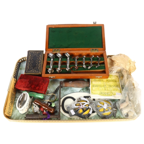 493 - A tray of interesting items, including corkscrews, car badges, Minton table lighter, prayer book, mi... 