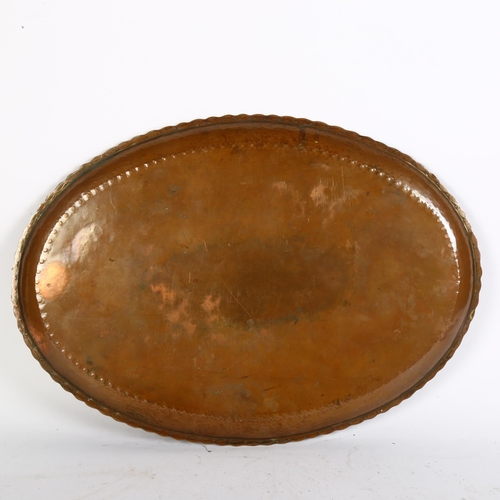 550 - A Vintage oval Arts and Crafts copper tray, L43cm