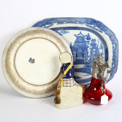 557 - A 19th century Willow pattern meat dish, 53cm, a painted dish, ruby glass Claret jug with embossed p... 