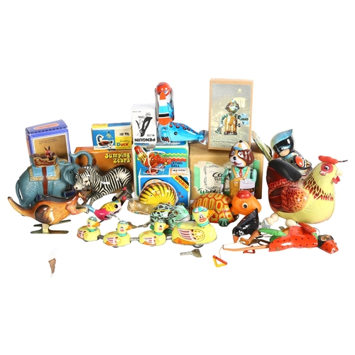 748 - A quantity of Vintage clockwork and wind-up tin toys, mostly in original boxes, including a jumping ... 