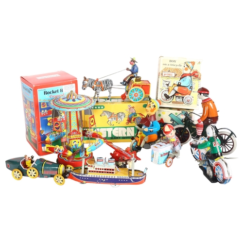 749 - A quantity of Vintage and modern wind-up tinplate toys, mostly in original boxes, including a Wester... 