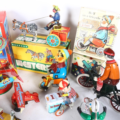 749 - A quantity of Vintage and modern wind-up tinplate toys, mostly in original boxes, including a Wester... 