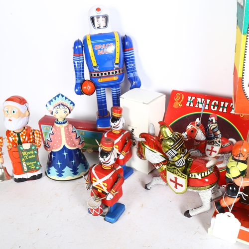 750 - A quantity of Vintage and modern tinplate wind-up clockwork toys, mostly in original boxes, includin... 