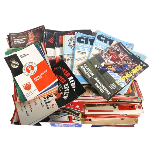 760 - A total of 328 items of Manchester United Football Club ephemera, including various football program... 