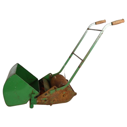 768 - A Vintage 1950s Webb miniature lawn mower, including grass bucket, height to handles 52cm