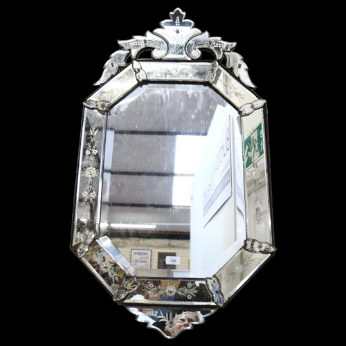 788 - A Venetian style mirror of stretched octagonal form, with foliate decoration, H102cm