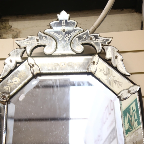 788 - A Venetian style mirror of stretched octagonal form, with foliate decoration, H102cm