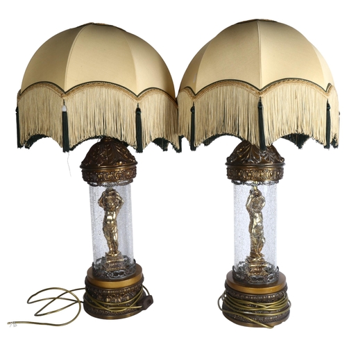 796 - A pair of American gilded spelter and crackle glazed table lamps, with domed tasselled shades, overa... 