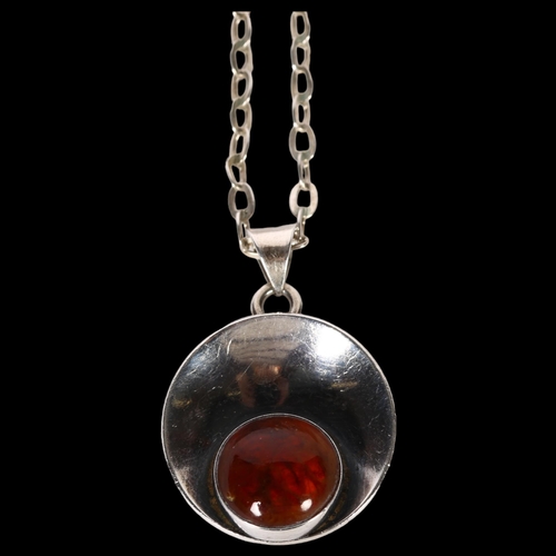 1003 - NIELS ERIK FROM - a sterling silver and amber set pendant and chain