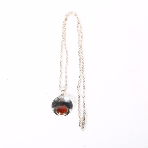 1003 - NIELS ERIK FROM - a sterling silver and amber set pendant and chain