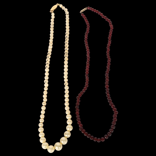 1006 - A single-strand pearl necklace, with an 18ct gold clasp, and a red stone single strand beadwork neck... 