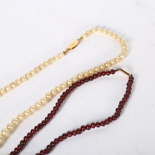 1006 - A single-strand pearl necklace, with an 18ct gold clasp, and a red stone single strand beadwork neck... 