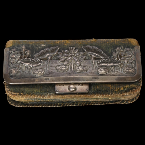 1011 - An Edward VII silver-mounted and green leather purse, with floral embossed decoration, London 1902, ... 